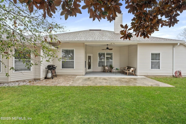 rear view of house with a lawn, ceiling fan, and a patio