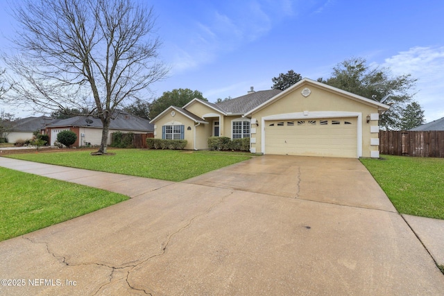 ranch-style house with a garage and a front lawn