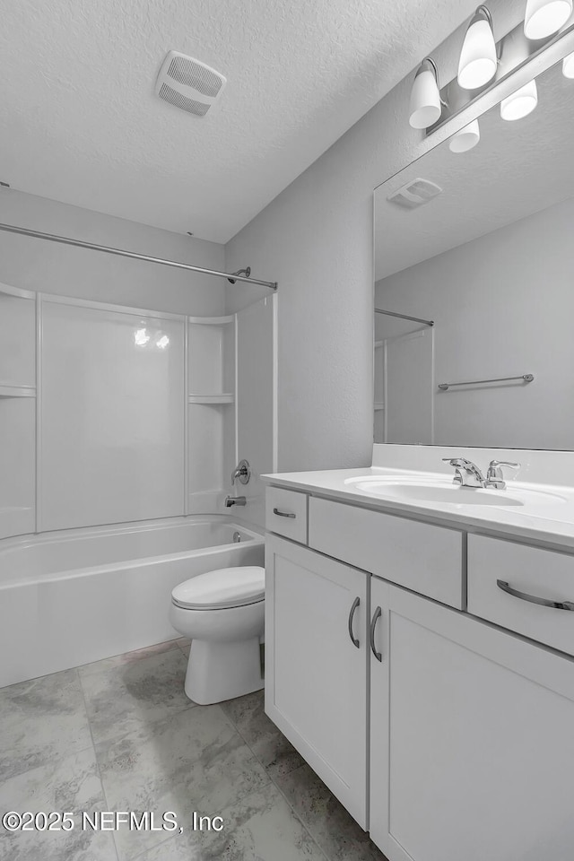 full bathroom with vanity, a textured ceiling, toilet, and shower / bath combination