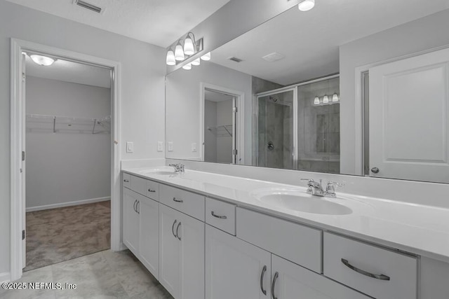 bathroom featuring vanity and walk in shower