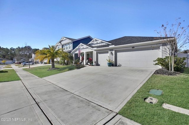 view of front of house featuring a front yard and a garage