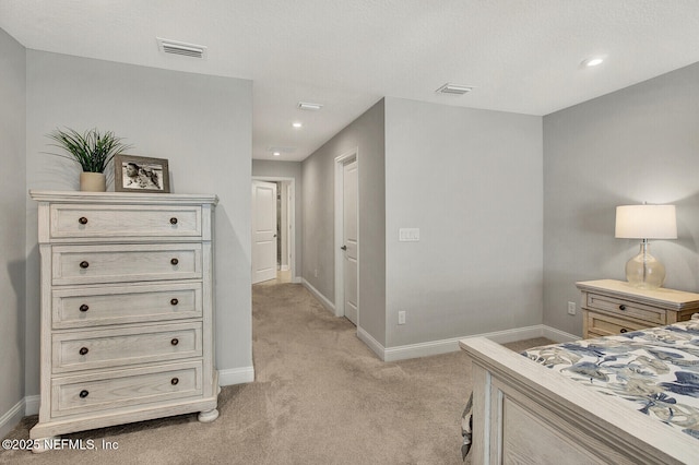 bedroom with light colored carpet