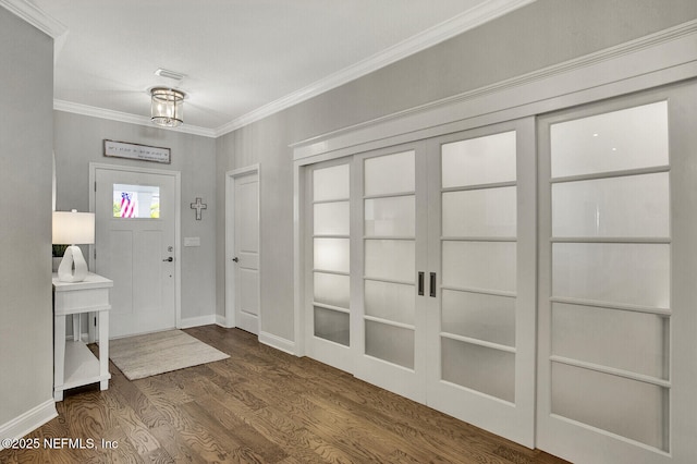 foyer with dark wood-type flooring and ornamental molding