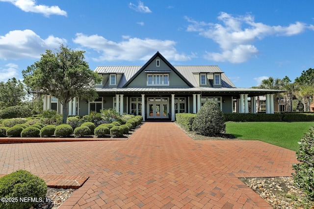 view of front of property featuring french doors and a front yard