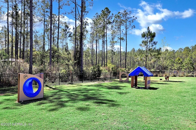 view of home's community with a yard