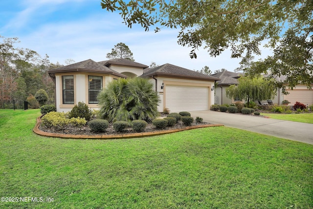 view of front of property with a garage and a front yard