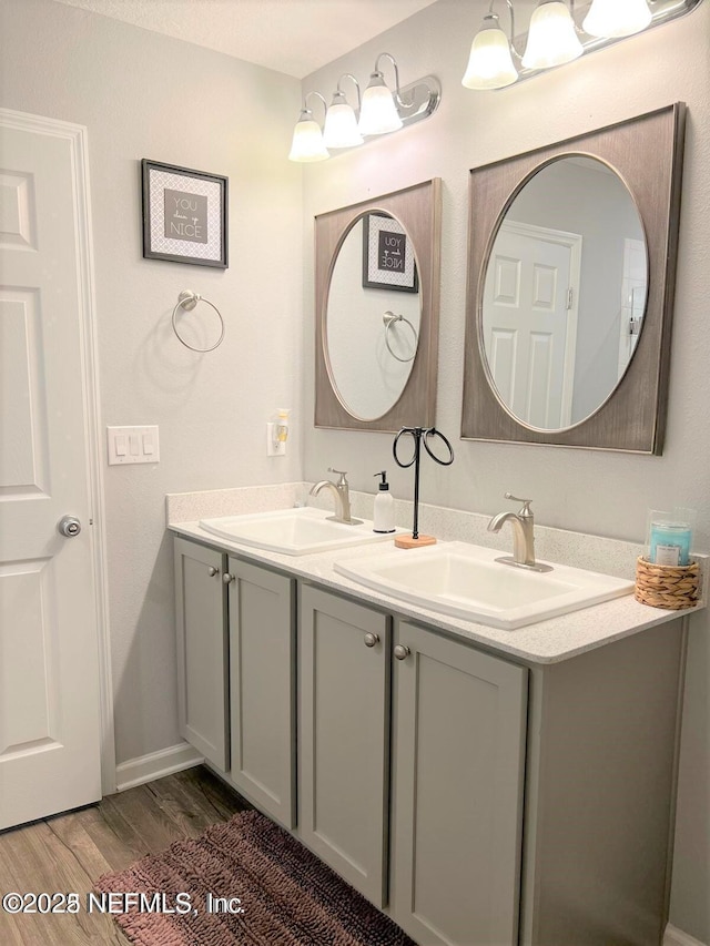 bathroom featuring vanity and hardwood / wood-style flooring