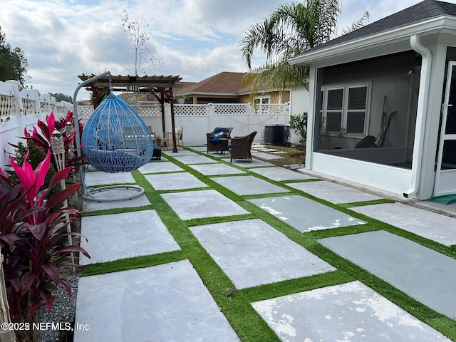 view of patio / terrace featuring a sunroom, a pergola, and central air condition unit