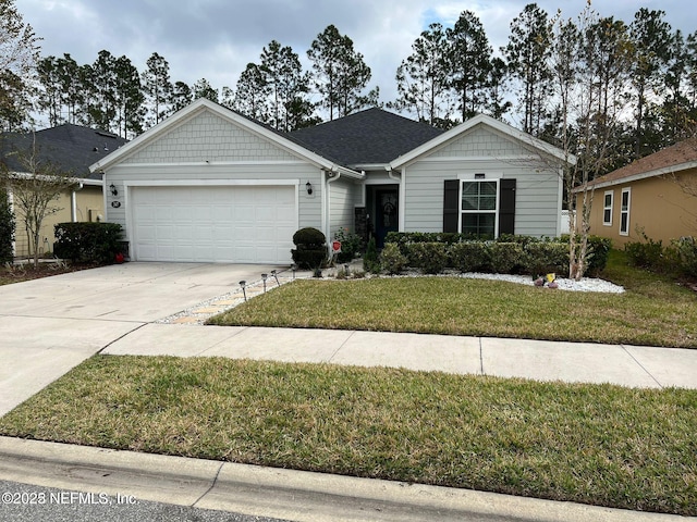 view of front of property featuring a garage and a front yard