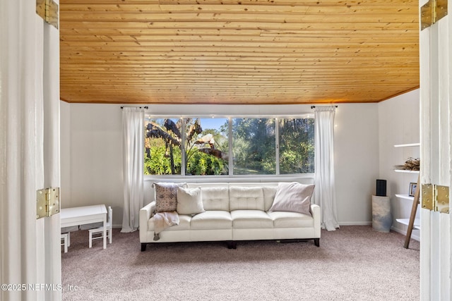 carpeted living room with wooden ceiling