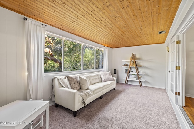 living room featuring carpet floors and wooden ceiling