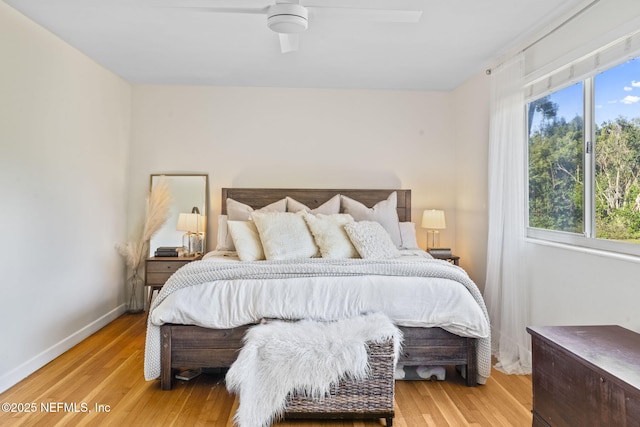 bedroom featuring hardwood / wood-style flooring and ceiling fan