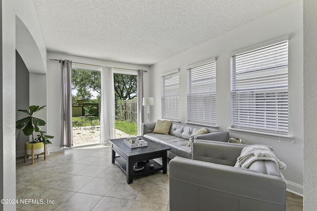 tiled living room with a textured ceiling