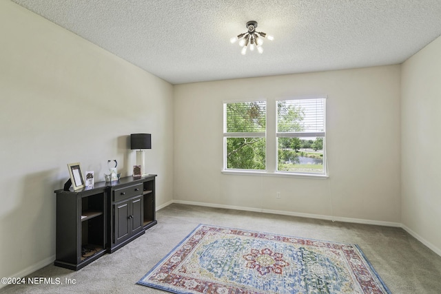 interior space featuring a textured ceiling