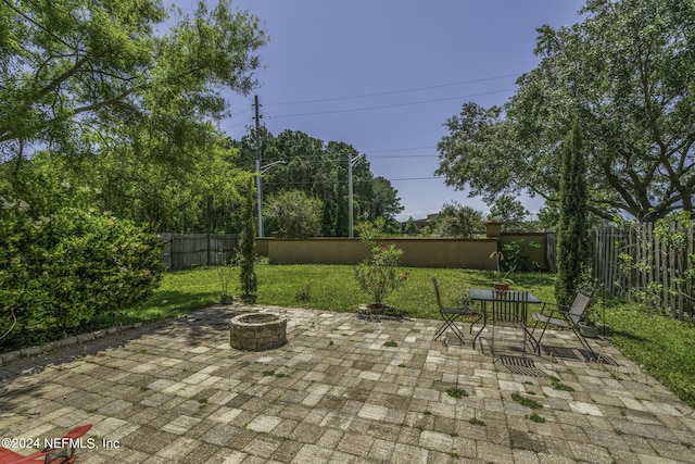 view of patio / terrace with an outdoor fire pit