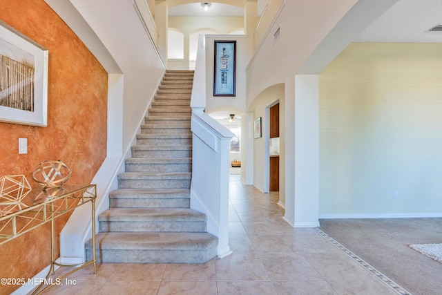 stairs with tile patterned flooring