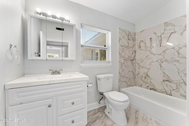 full bathroom featuring toilet, tiled shower / bath, and vanity