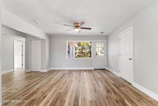 unfurnished room featuring ceiling fan and light hardwood / wood-style flooring