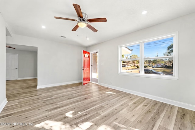 empty room featuring light hardwood / wood-style floors and ceiling fan