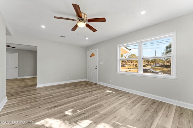 unfurnished room with ceiling fan and light hardwood / wood-style floors