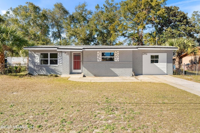 ranch-style home with a front lawn