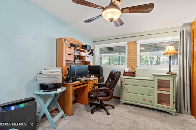 home office featuring light colored carpet and ceiling fan