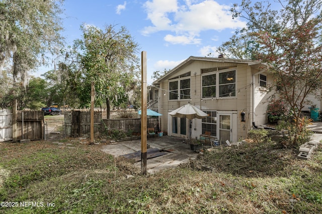 back of house with a patio area