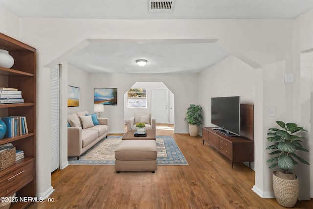 living room with light hardwood / wood-style floors