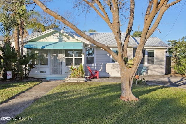 bungalow-style house with a front lawn