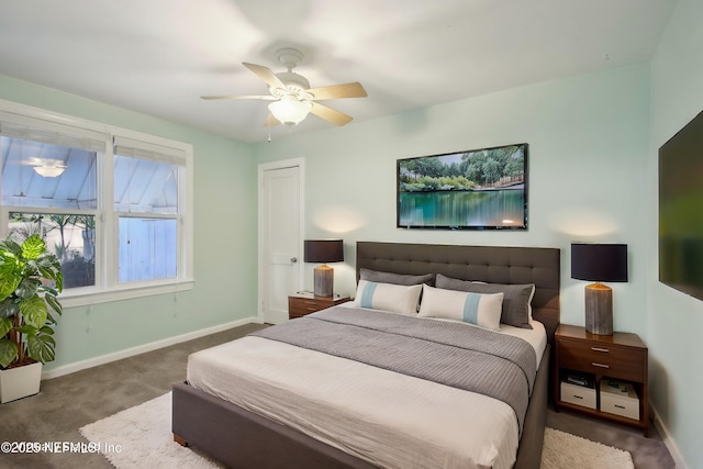 bedroom with dark colored carpet and ceiling fan