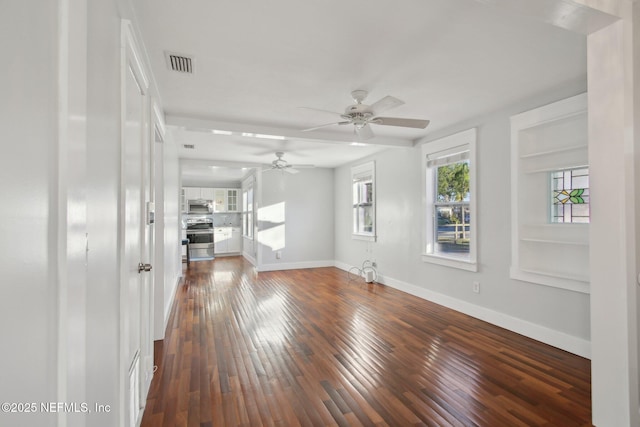 unfurnished living room with ceiling fan, built in features, and dark wood-type flooring