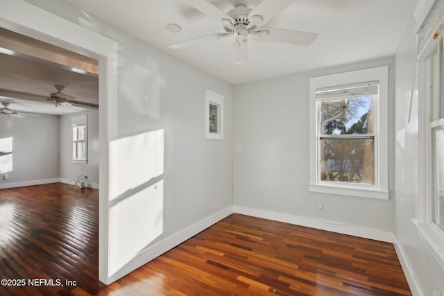 unfurnished room featuring dark hardwood / wood-style flooring and ceiling fan