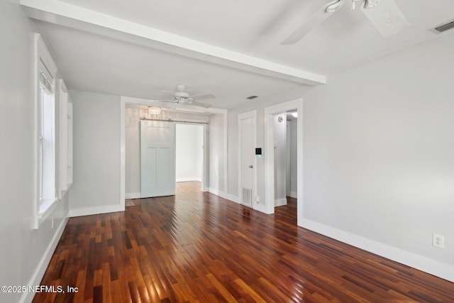 spare room featuring ceiling fan and dark hardwood / wood-style flooring