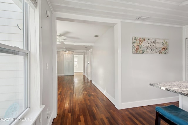 corridor featuring dark hardwood / wood-style flooring and ornamental molding