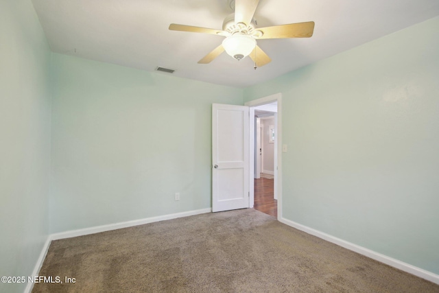 unfurnished room with carpet floors and ceiling fan