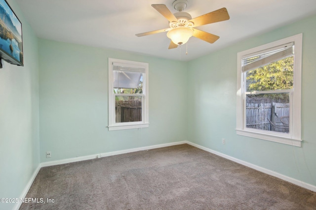 empty room featuring ceiling fan and carpet flooring