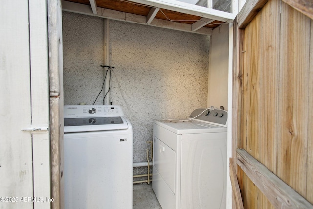 laundry room featuring separate washer and dryer