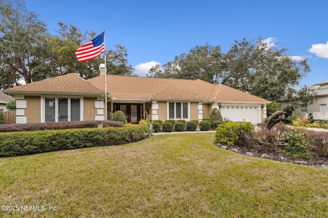 single story home with a front lawn and a garage