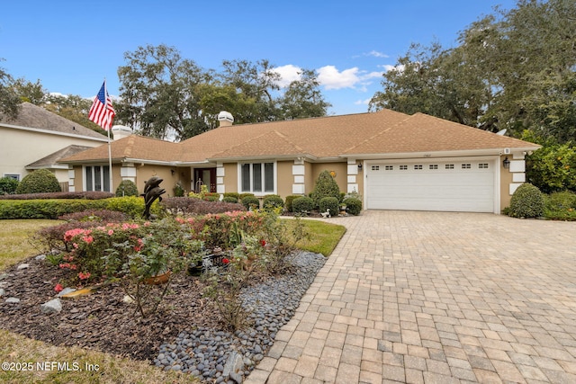 ranch-style home with a garage