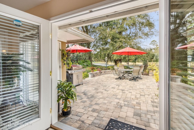 view of patio with a grill