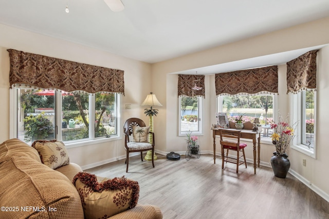 living area with hardwood / wood-style floors