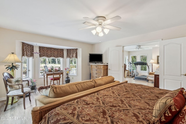 bedroom featuring ceiling fan and hardwood / wood-style floors