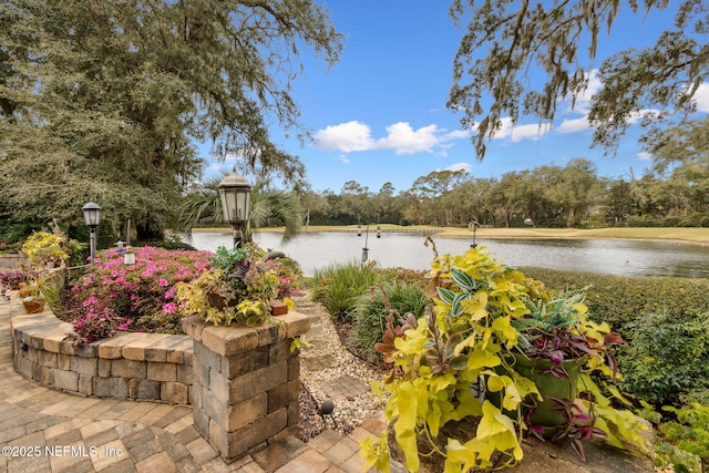 view of patio featuring a water view