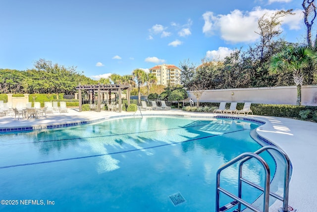 view of swimming pool featuring a pergola and a patio