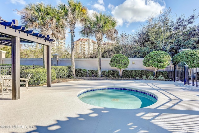 view of swimming pool with a patio and an in ground hot tub