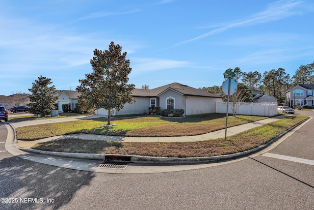 ranch-style house featuring a front lawn