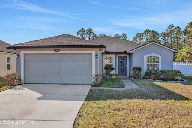 ranch-style home with a front lawn and a garage