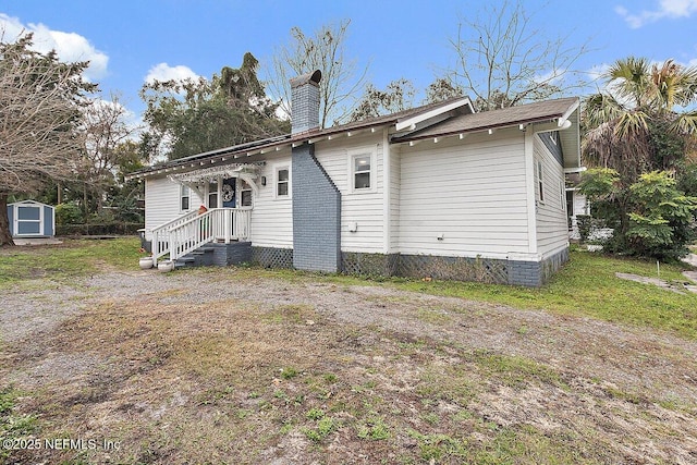 exterior space with a storage shed