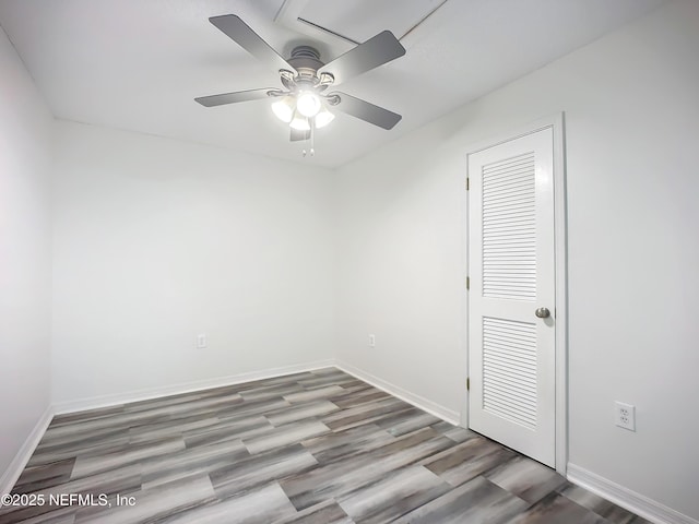 unfurnished room featuring ceiling fan and light wood-type flooring