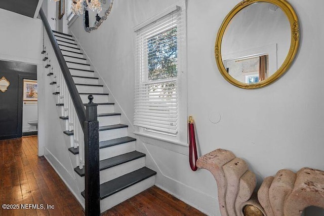 stairway featuring hardwood / wood-style floors